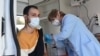 Armenia - A man is vaccinated against coronavirus at a mobile vaccination center in Yerevan, October 24, 2021.