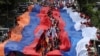 Armenia - People carry giant Armenian and Russian flags as they mark the 78th anniversary of Soviet victory over Nazi Germany, May 9, 2023.