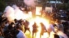 Armenia - Police fire a stun grenade at protesters in Yerevan, June 12, 2024.