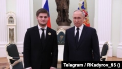 Владимир Путин и сын главы Чечни Ахмат Кадыров в Кремле. Москва, Россия, 4 марта 2023 года