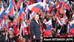 Президент России Владимир Путин на концерте, посвященном восьмилетию «присоединения» Крыма. Международное сообщество считает захват украинского полуострова аннексией. Москва, 18 марта 2022 года 