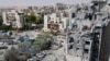 Emergency workers check the damage caused to a building from an Iranian missile strike in Beersheba in southern Israel on June 24, 2025.