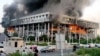A building of Iranian state broadcaster IRIB in flames after an Israeli air attack in Tehran