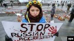 Під час акції вшанування загиблих внаслідок обстрілу Маріуполя реактивними системами залпового вогню з боку російських гібридних сил. Київ, 25 січня 2015 року