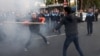 Armenia - Shant Harutiunian (L) clashes with another man during an anti-government demonstration in Yerevan, 5 November, 2013.