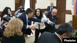 Armenia - Marina Khachatrian of the opposition Yerkir Tsirani party is confronted by pro-government members of Yerevan's municipal assembly, 13 February 2018.